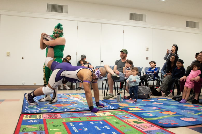 California Championship Wrestlers Nahual (left) and Blaqlight demonstrate an ankle lock Saturday, April 12, 2025, at Rancho Cordova Library. California Championship Wrestlers Nahual (left) and Blaqlight demonstrate an ankle lock Saturday, April 12, 2025, at Rancho Cordova Library.
