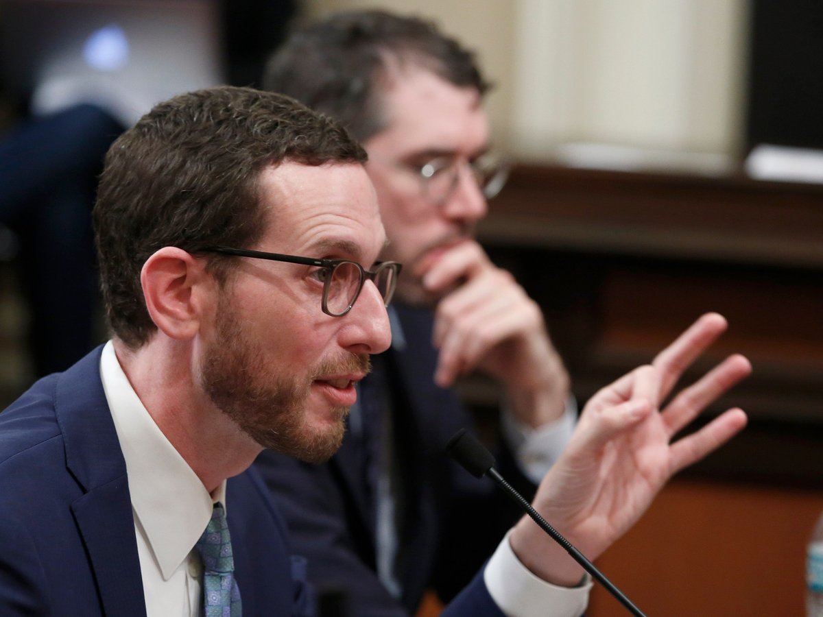 State Sen. Scott Wiener, D-San Francisco, left, discusses his housing measure, SB50, during a committee hearing Wednesday, April 24, 2019, in Sacramento.