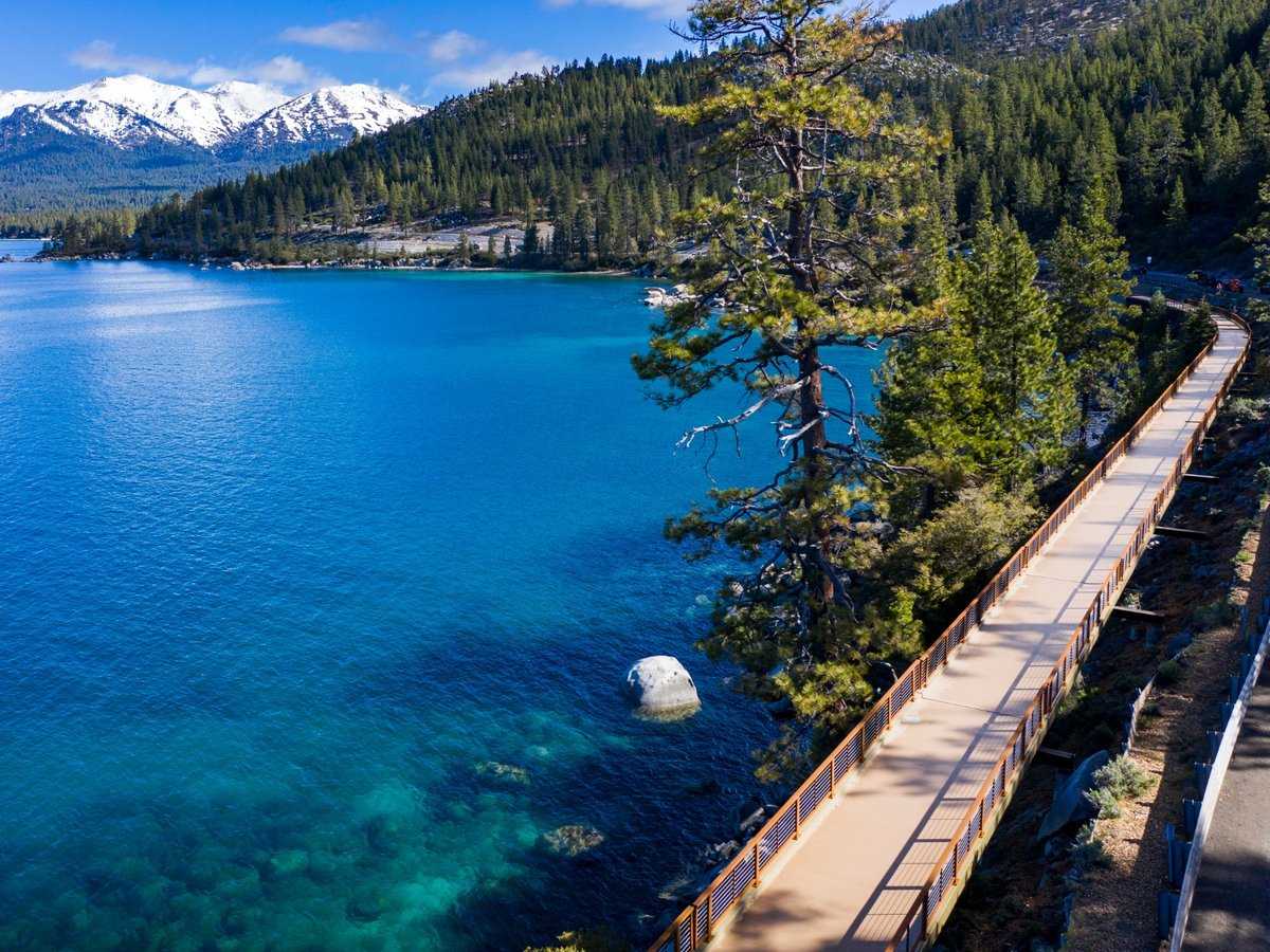 A new bicycle and pedestrian trail hugging the northeast shore of Lake Tahoe is providing new, safer access to hidden beaches and a bird's-eye view of the lake's blue waters.
