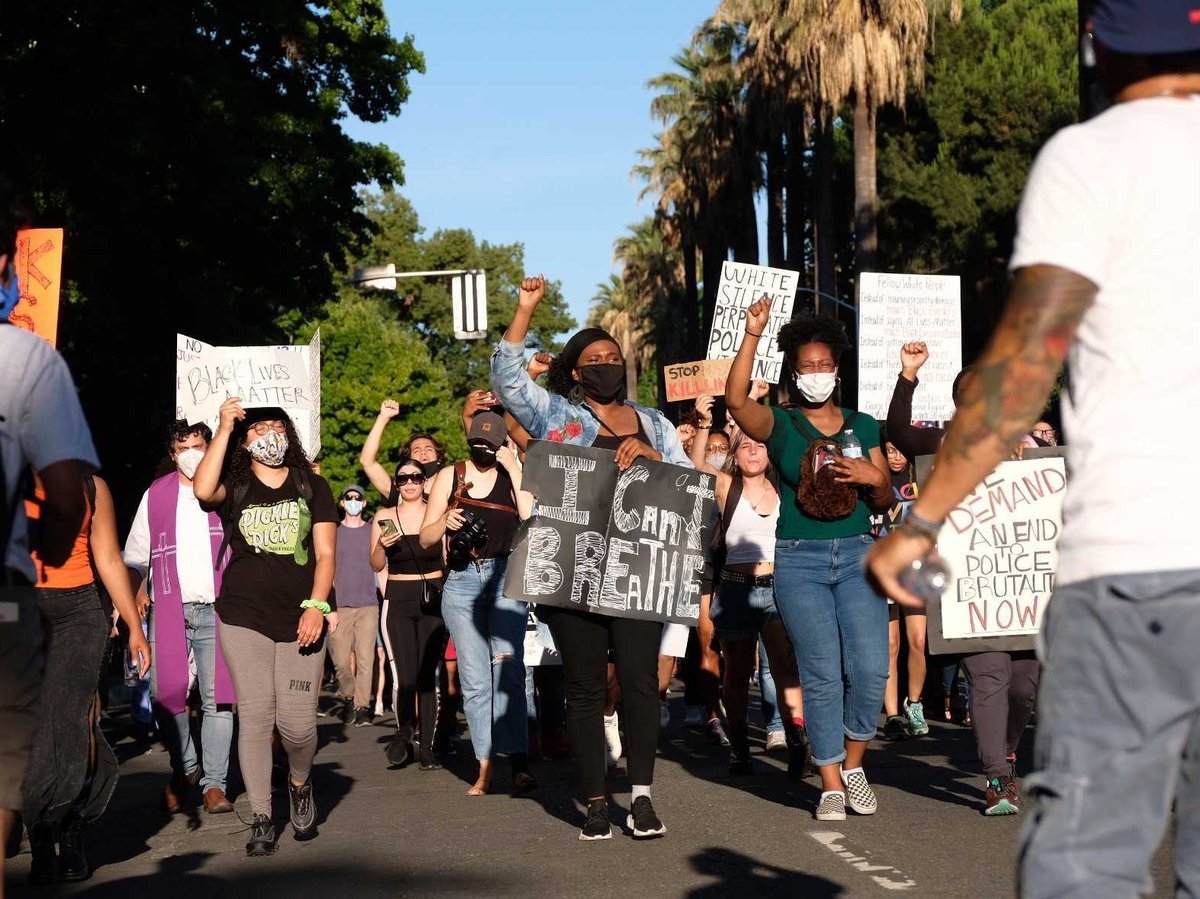 Demonstrators march down L Street in downtown Sacramento on June 3, 2020 to protest the killing of George Floyd by Minneapolis police.