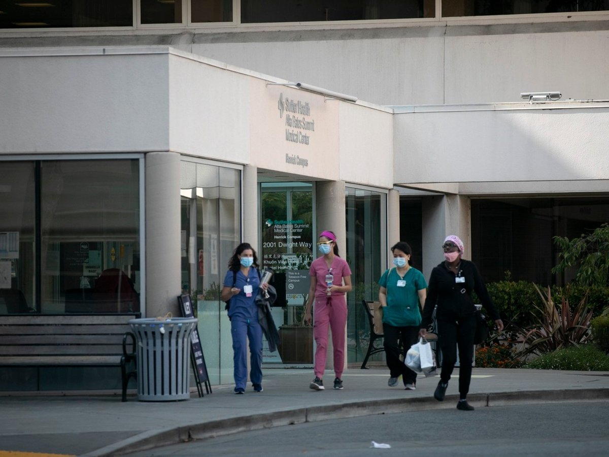 Hospital employees leave Alta Bates Hospital in Berkeley on August 24, 2020.