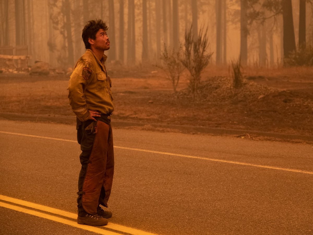 Megalia Calif. based CalFire firefighter, Itto Akiyama, rests briefly after 48 hours of work at the Bear Fire near Oroville, Calif. Wednesday., Sept 9. 2020.