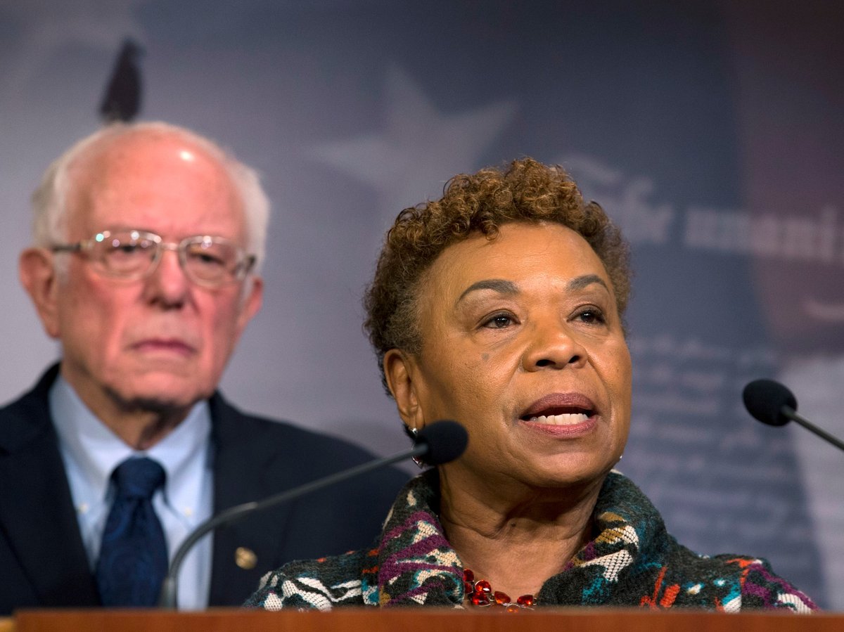 Rep. Barbara Lee, D-Calif., flanked by Sen. Bernie Sanders, I-Vt., speaks during a news conference on a measure limiting President Donald Trump's ability to take military action against Iran, on Capitol Hill, in Washington, Thursday, Jan. 9, 2020.