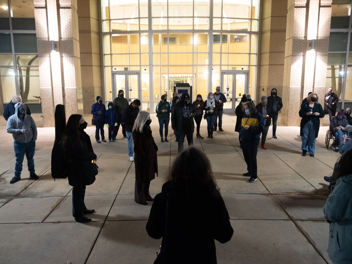 People read out 90 names of unhoused people who have died in Sacramento in 2020 at a memorial at City Hall, Dec. 21, 2020.
