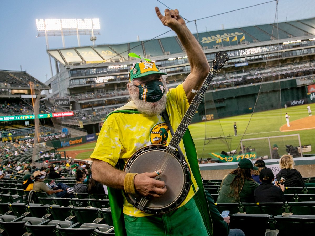 San Francisco resident Stacy Samuels, also known as Super A or Banjo Man, plays the banjo while cheering in the stands. Samuels, who has been bringing his banjo to Athletics games for more than 30 years, said “It’s great.