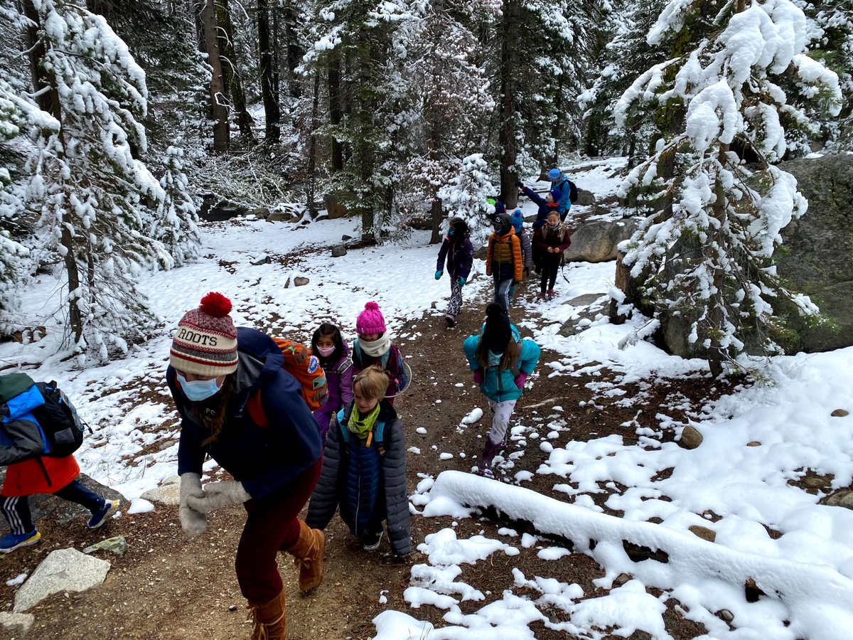 TINS day camp kids hike on a trail near Donner Lake.