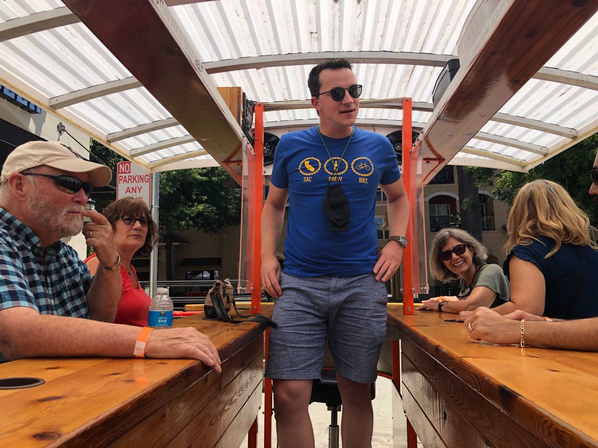 Sac Brew Bike Driver Jimmy Fremgen talks with his group between stops on a tour Tuesday, June 15, 2021. Photo by Scott Rodd.