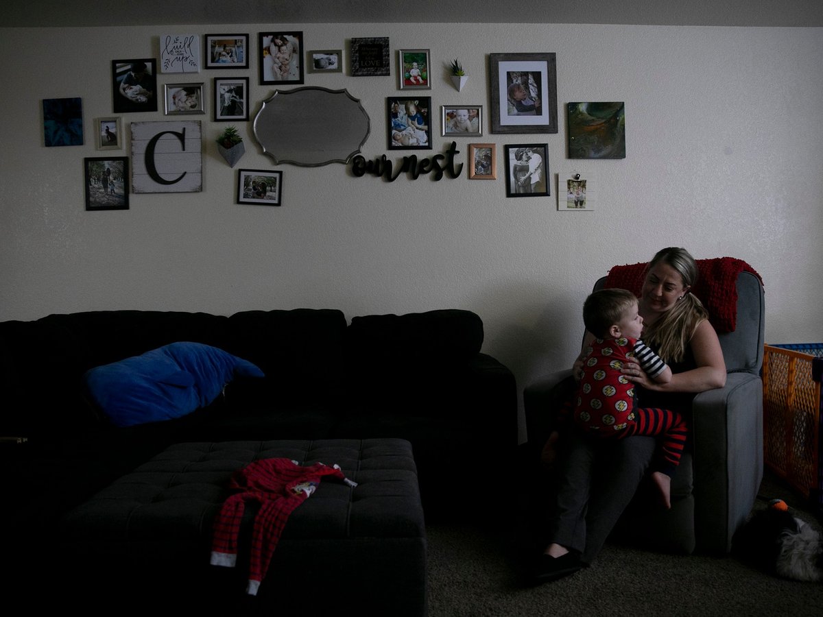 Miranda Griswold cuddles her three-year-old, Rhys, before bedtime at their Merced home on July 8, 2021. “Six weeks is nothing,” Griswold said of the current family leave allotment.
