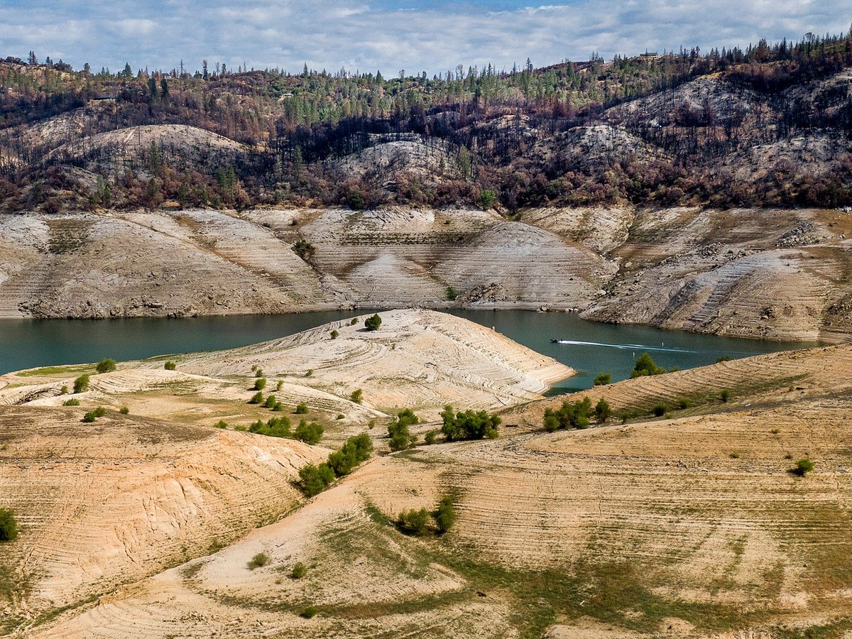 A boat crosses Lake Oroville on May 23, 2021. At the time, the reservoir was at 39% of capacity and 46% of its historical average, creating water shortages.