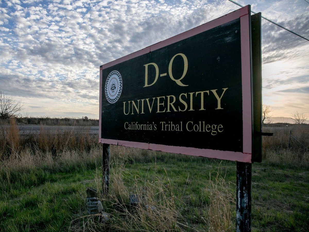 The sign for shuttered D-Q University remains standing along Country Road 31 in Yolo County on January 21, 2021.