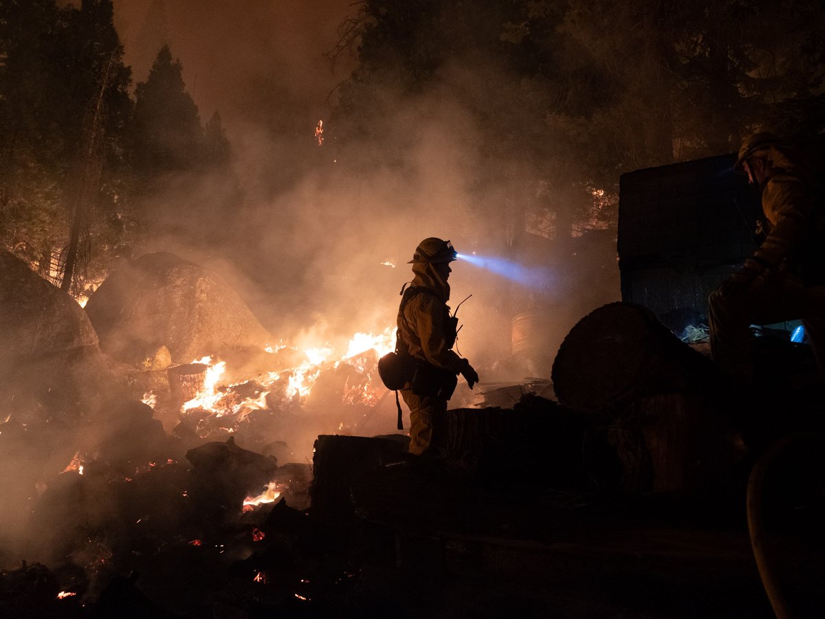 Firefighters protect homes in Christmas Valley from the Caldor Fire Monday, Aug. 30, 2021.
