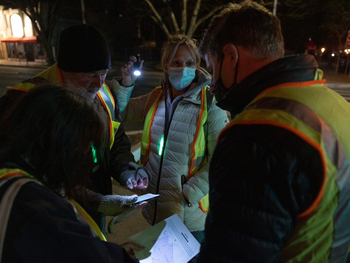 Sacramento PIT count volunteers look over a map of the area they are assigned to count and interview people experiencing homelessness on Wednesday, Feb. 23, 2022.