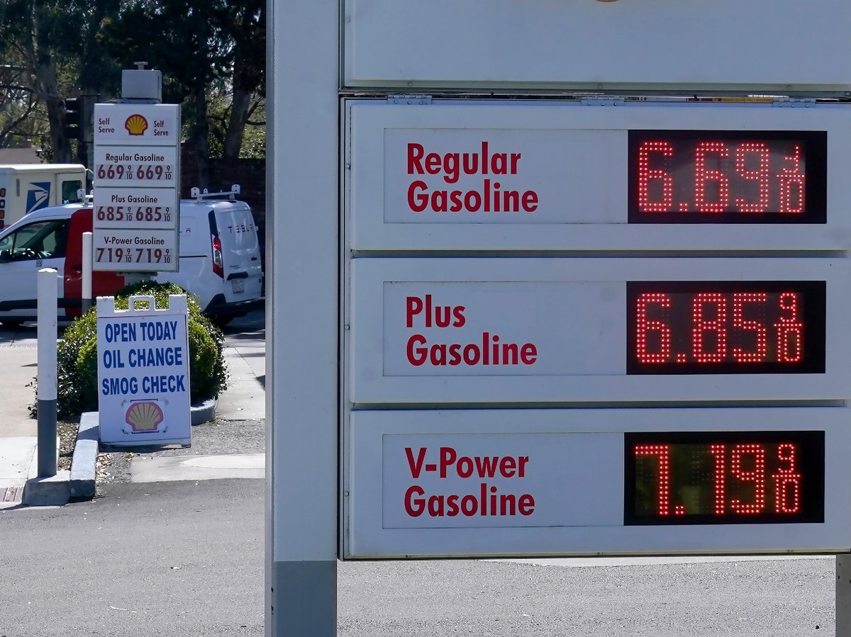 The gasoline price board is shown at a gas station in Menlo Park, Calif., on March 21, 2022.