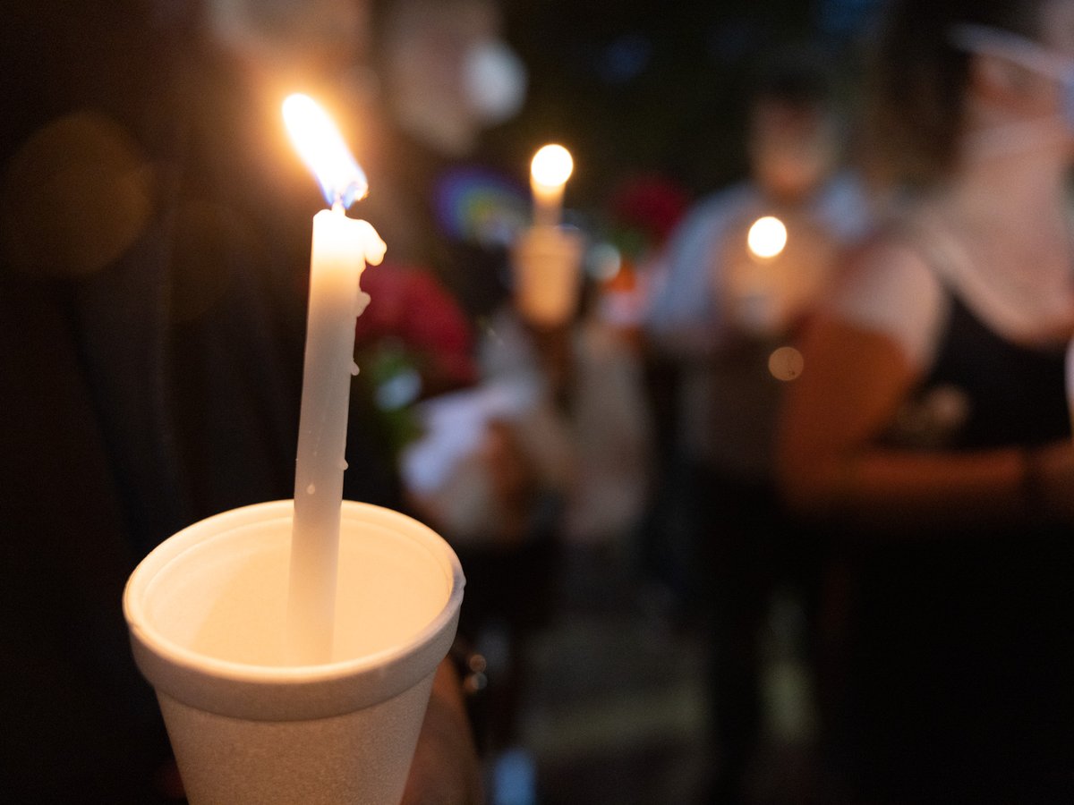 Vigil attendees gather at 7th and K street in Downtown Sacramento on Monday, April 4, 2022.