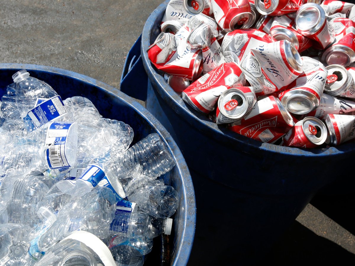 Cans and plastic bottles brought in for recycling fill containers at a recycling center in Sacramento, Calif., July 5, 2016