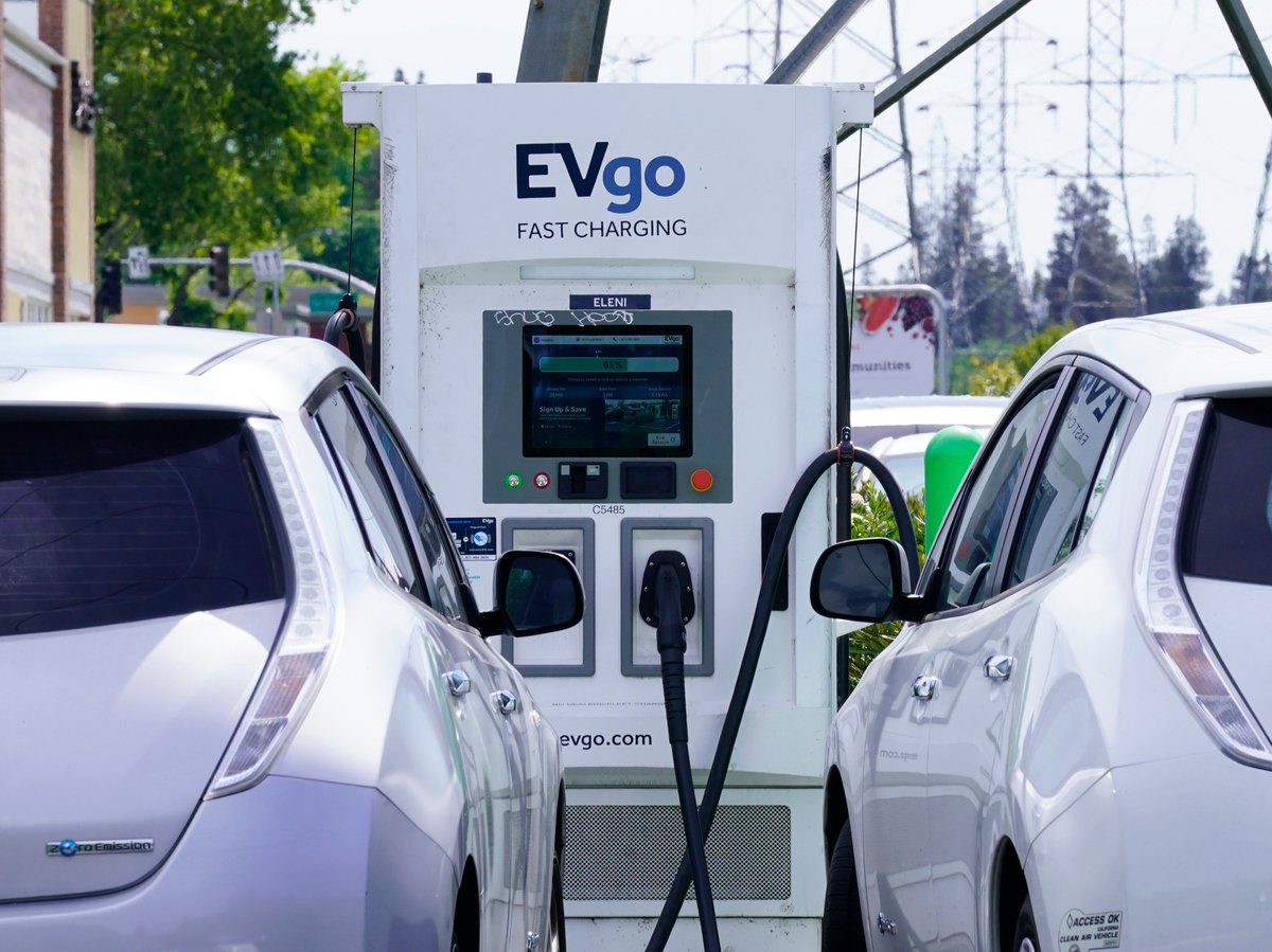 Electric cars are parked at a charging station in Sacramento, Calif., Wednesday, April 13, 2022.