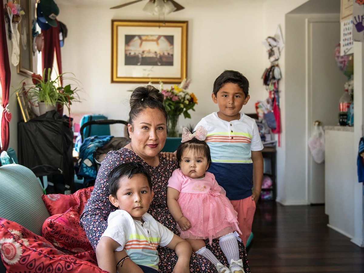 Mayra Paniagua and her three children inside their home in Oxnard on May 14, 2022.
