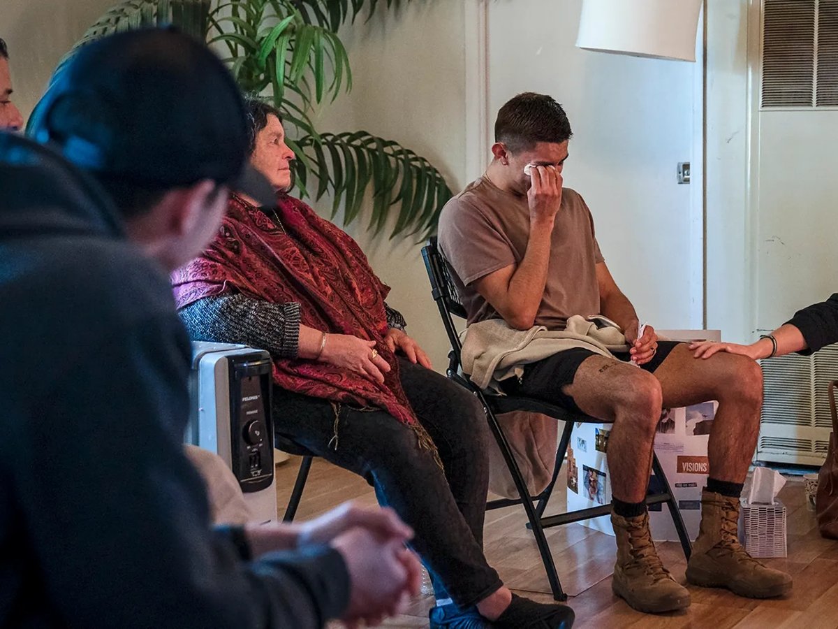 A CalFire employee tries to comfort another participant during a healing retreat at the Nurturing Nest in Desert Hot Springs on Feb. 25, 2022.