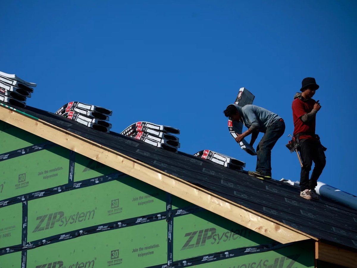 Contractors work on the roof of a house under construction in Louisville, Ky. A new study shows the U.S. is 3.8 million homes short of meeting housing needs.