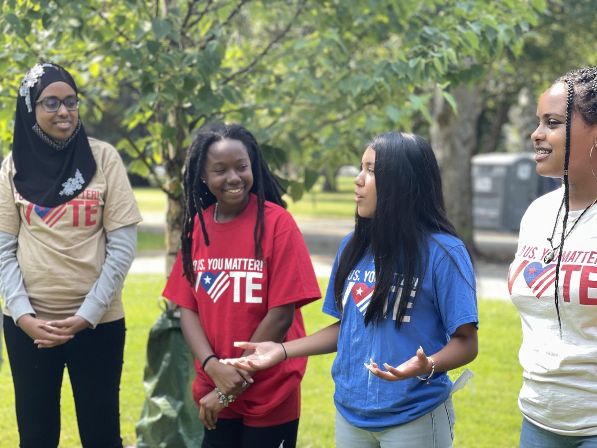 Jennifer Hernandez (in blue) getting out the vote as part of her work with the MLK Freedom Center.
