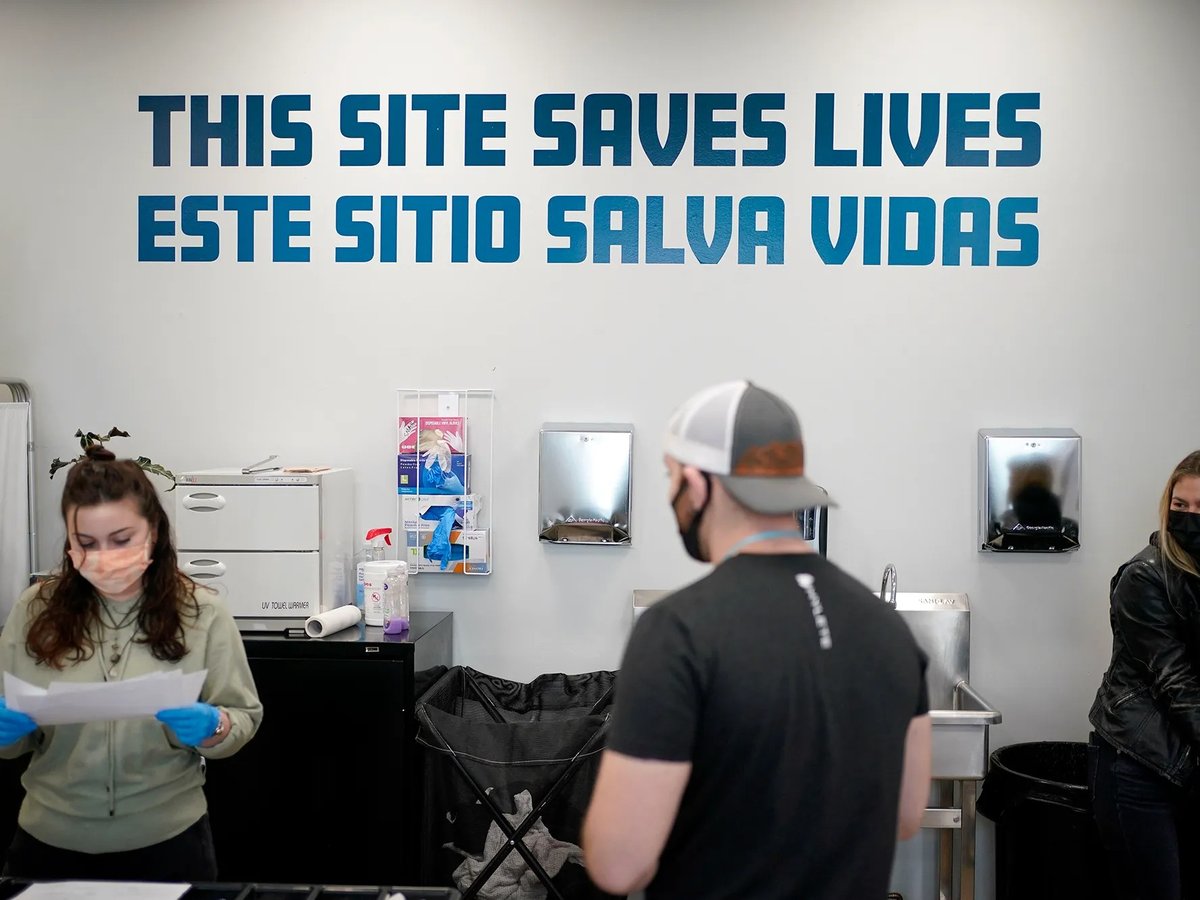 A sign on a wall reads "This site save lives" in Spanish and English at an overdose prevention center at OnPoint NYC in New York on Feb. 18, 2022.
