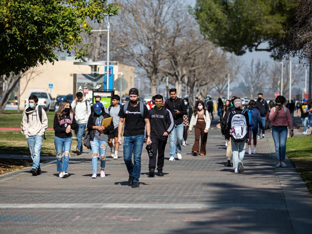 Students walk across the campus at Fresno State in Fresno, on Tuesday, Feb. 8, 2022.
