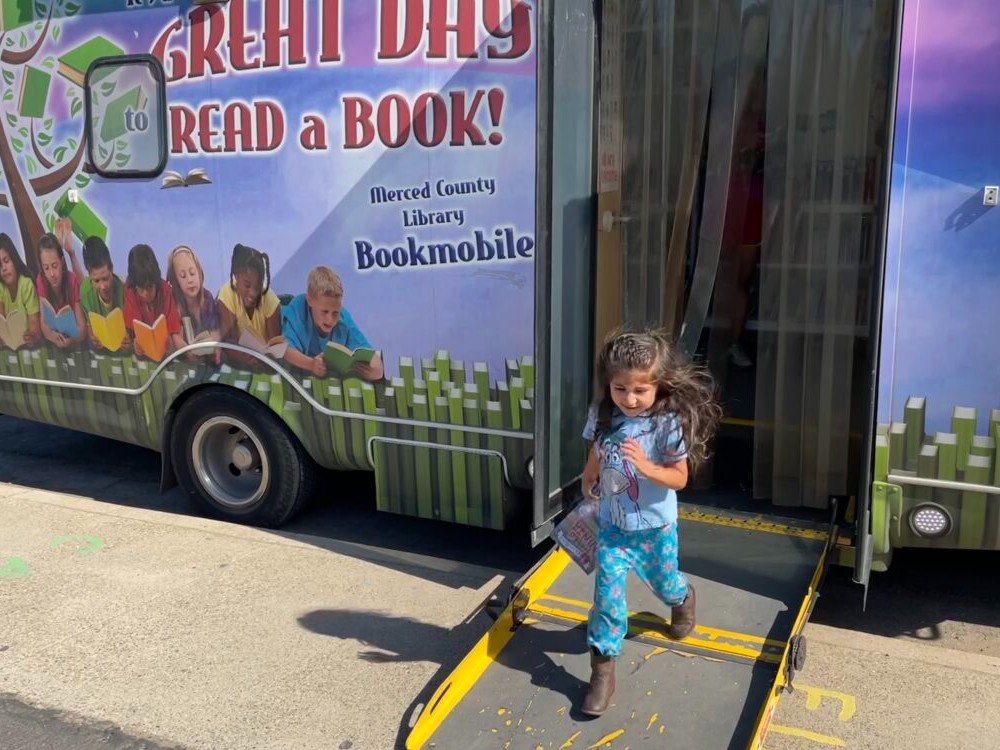 Annamarie Rodriguez enjoys it when the Merced County Library bookmobile stops in the town of Planada on Tuesdays.