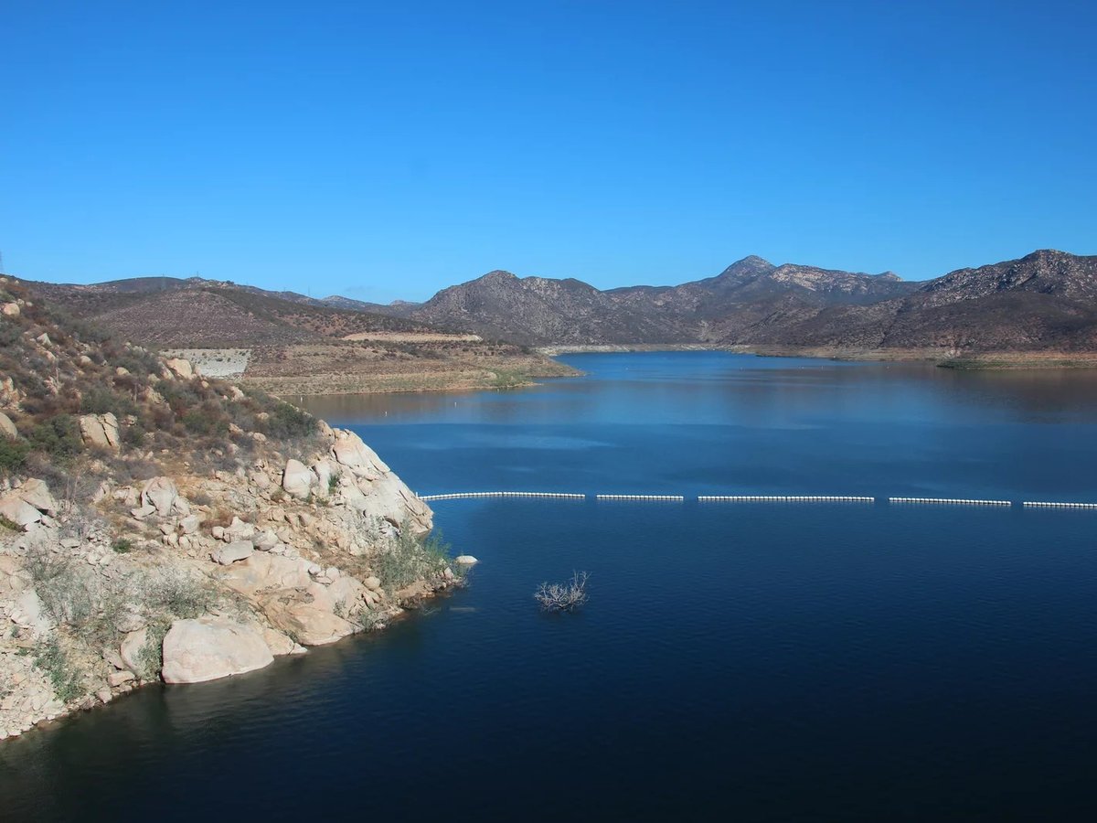 The San Vicente reservoir in San Diego County stores water from as far away as the Colorado River. Pumping water into a smaller reservoir in the surrounding mountains could store excess solar power until it's needed, when the sun sets.