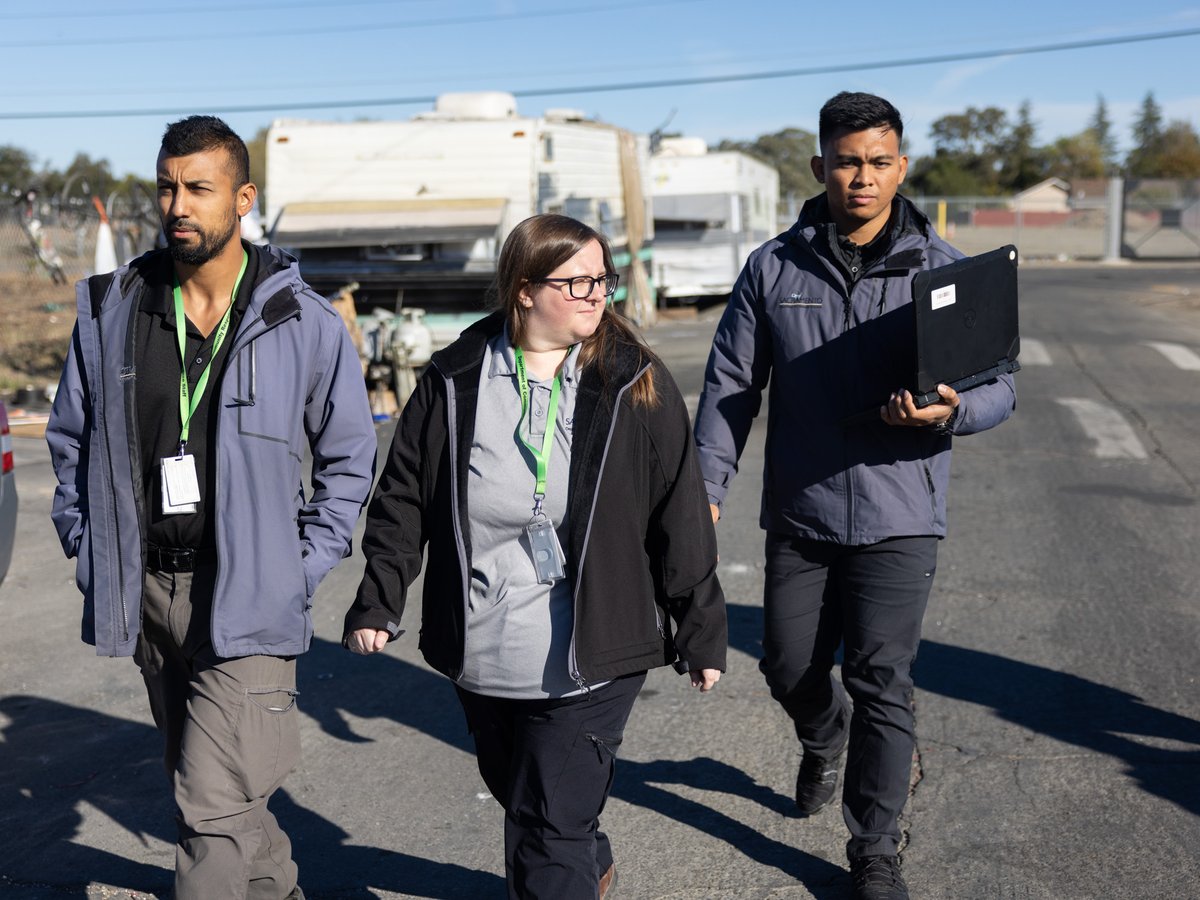 Sacramento city homeless outreach workers Jawid Sharifi, Hailey Weaslee and Earl Sapno walk through North Sacramento on Oct. 24, 2022. Teams like theirs, but bolstered with county mental health workers, are part of a new city-county agreement.