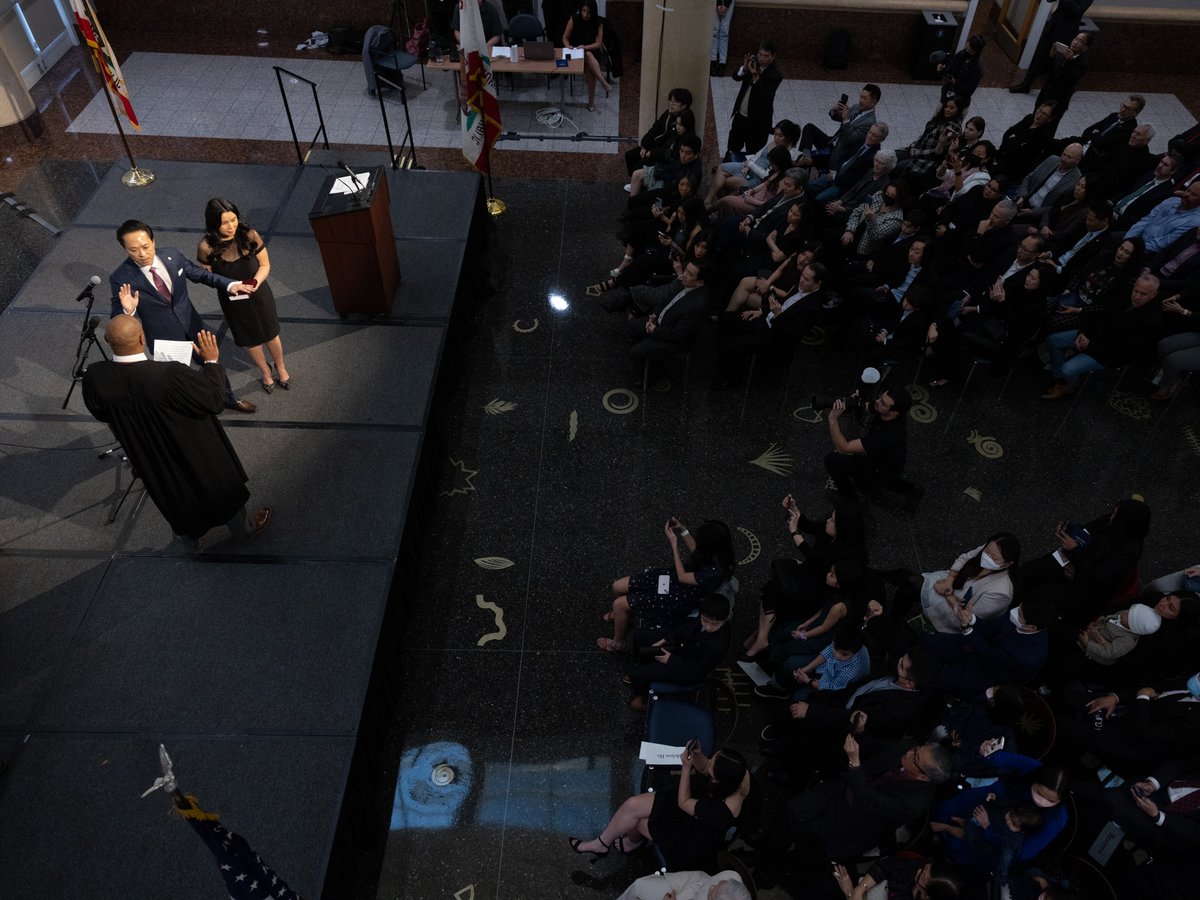 Judge Carlton Davis swears in Sacramento County D.A. Thien Ho at the Tsakopoulos Gallery, alongside his spouse, Jenny Ho, in Sacramento, Calif., Tuesday, Jan. 3, 2023. Andrew Nixon