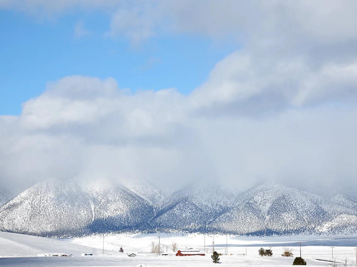 Snow covered peaks are viewed after a series of atmospheric river storms brought heavy snowfall to the region on January 22, 2023 near Mammoth Lakes, California.