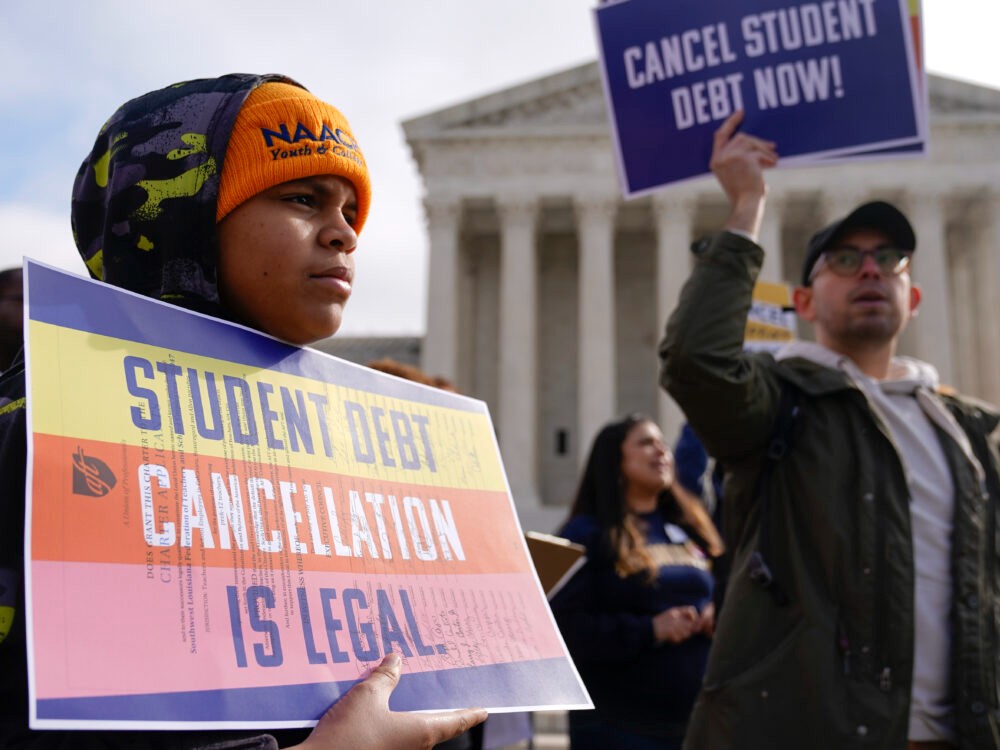 Student debt relief advocates gather outside the Supreme Court on Capitol Hill in Washington on Feb. 28, 2023, ahead of arguments over President Joe Biden's student debt relief plan.