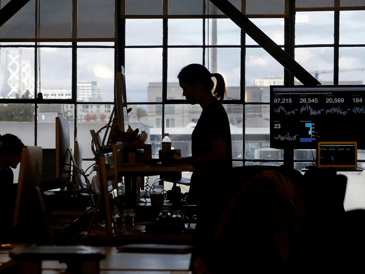 Employees at Pinterest work at their desks in San Francisco on Nov. 13, 2014.