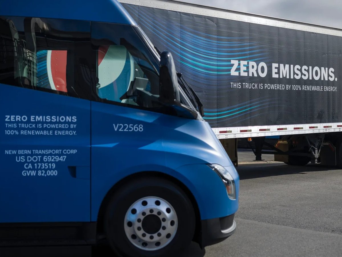A fleet of Tesla trucks on display at PepsiCo Beverages North America's Sacramento facility on April 11, 2023. The company hosted an event to celebrate the arrival of 18 electric big rigs.