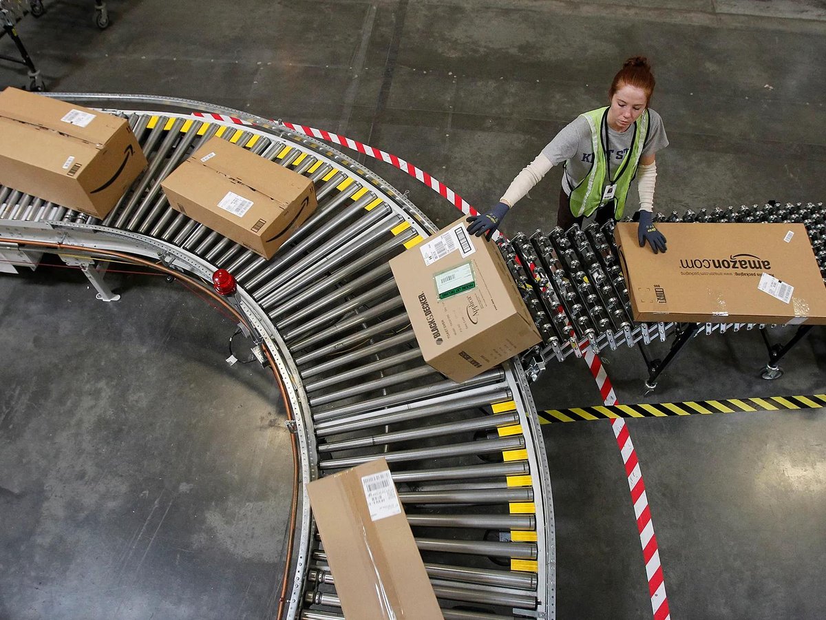 A warehouse worker sorts packages at an Amazon fulfillment center on Nov. 11, 2010.