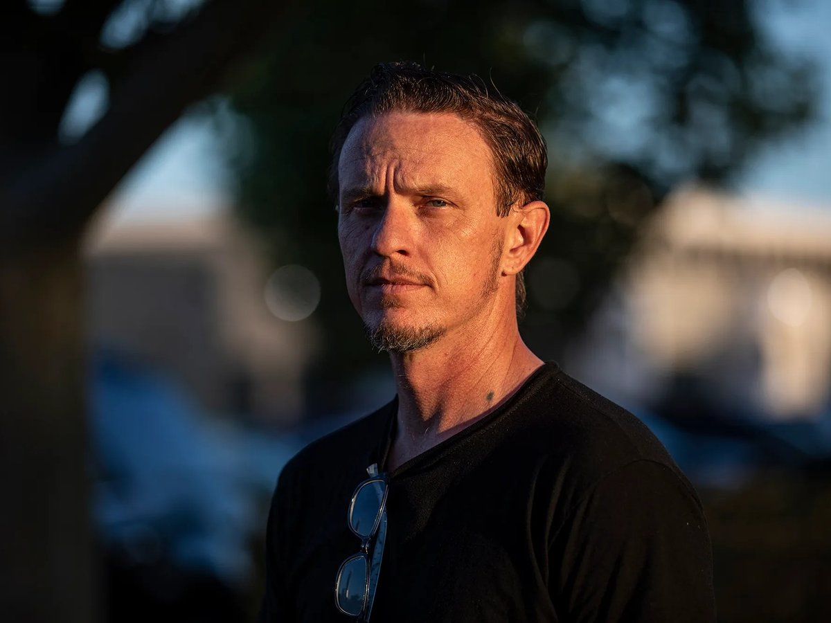 David Zemp stands on the sidewalk near a street in Lancaster on May 10, 2023. Zemp is a former inmate but is now getting ready to graduate from college courses he took while incarcerated.