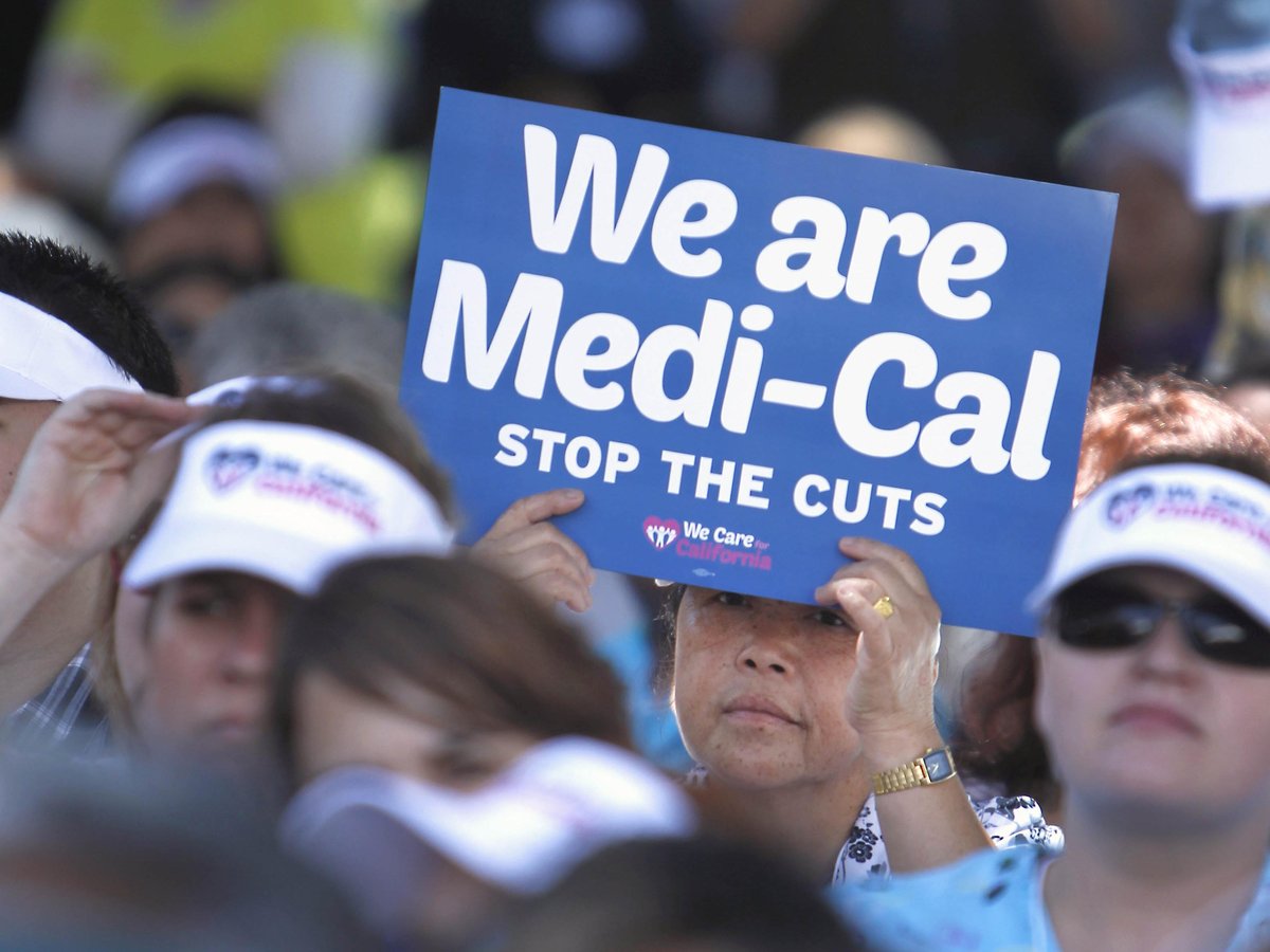 Sign carrying demonstrators representing doctors, hospitals and unionized health care workers rallied against a 10 percent cut in the amount the state pays for Medi-Cal reimbursements, at the Capitol in Sacramento, Calif., Tuesday, June 4, 2013.