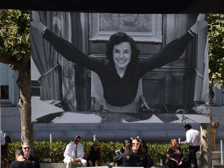 A photo montage of Senator Dianne Feinstein plays before her memorial service at City Hall in San Francisco on Thursday, Oct. 5, 2023.