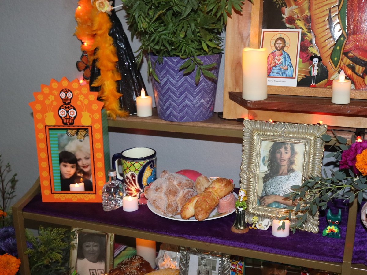 Linley Saunders includes pan de muerto as part of her Dia de los Muertos ofrenda in her Sacramento home on Oct. 28, 2023.