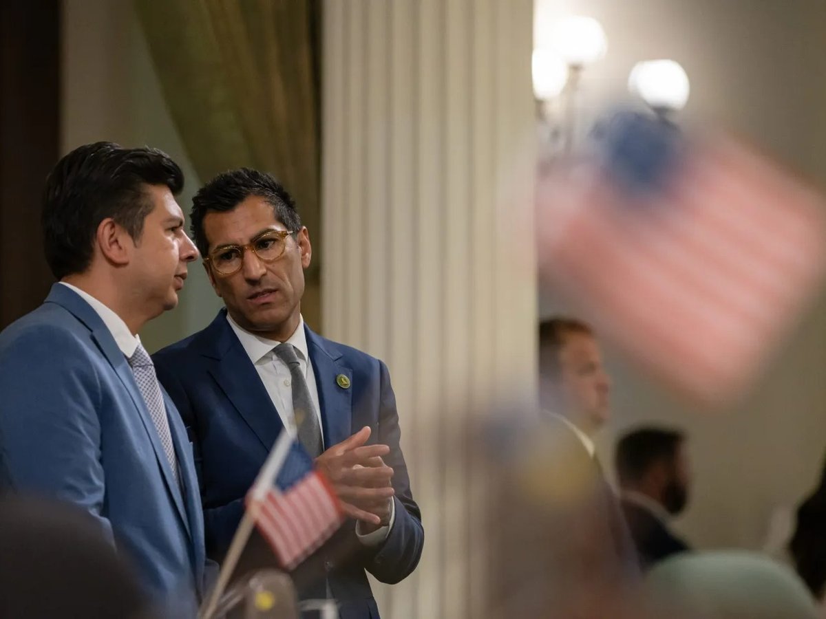 Assembly Speaker Robert Rivas, right, talks with Assemblymember David Alvarez, a San Diego Democrat, during session at the state Capitol in Sacramento on Aug. 24, 2023.