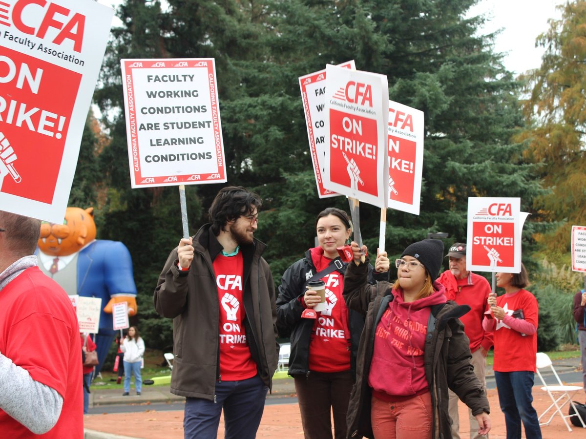 Members of the California Faculty Association picket during a strike at Sacramento State on Thursday, Dec. 7, 2023, in Sacramento, Calif.