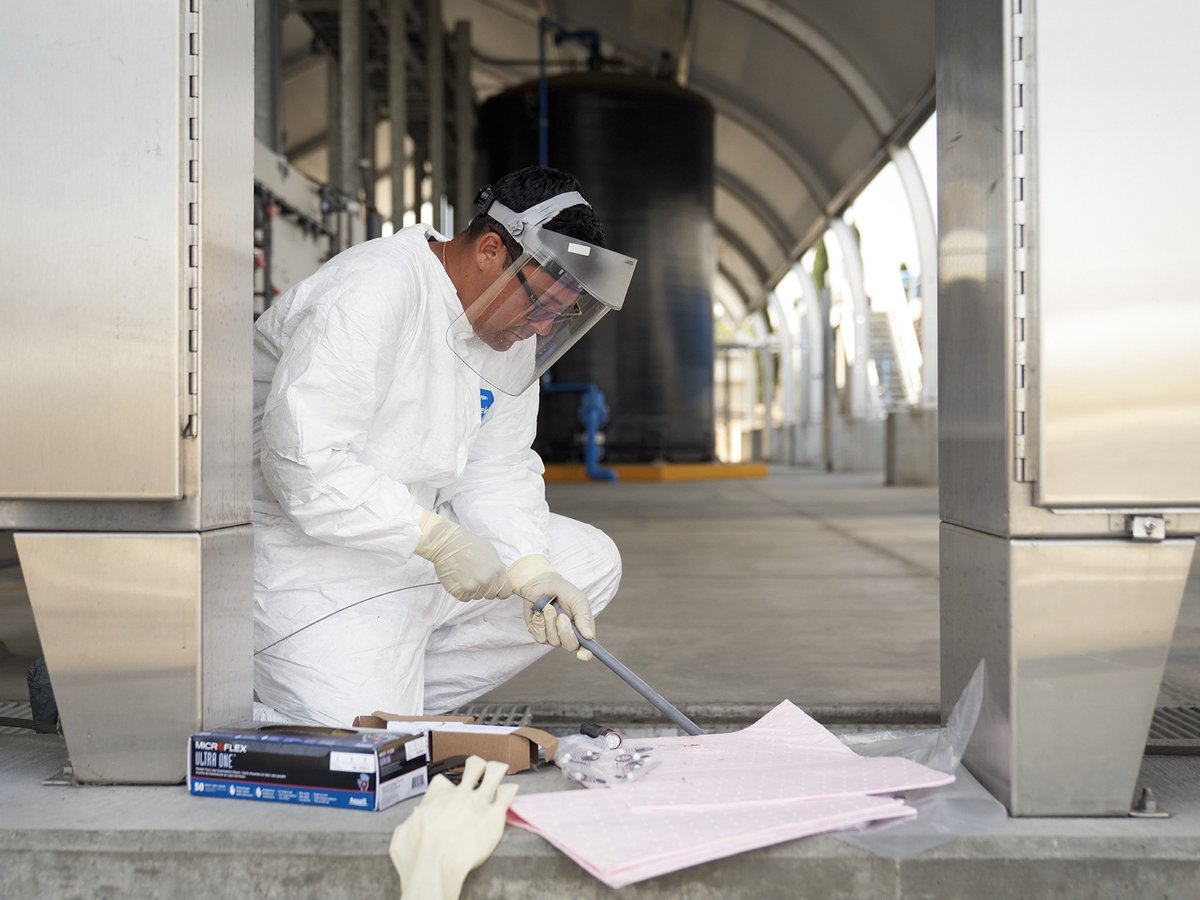 Luis Canela, a water quality technician, injects sodium hypochloride and armonium sulfate to treat water at the Pure Water Southern California Demonstration Plant in Carson, on July 28, 2023.