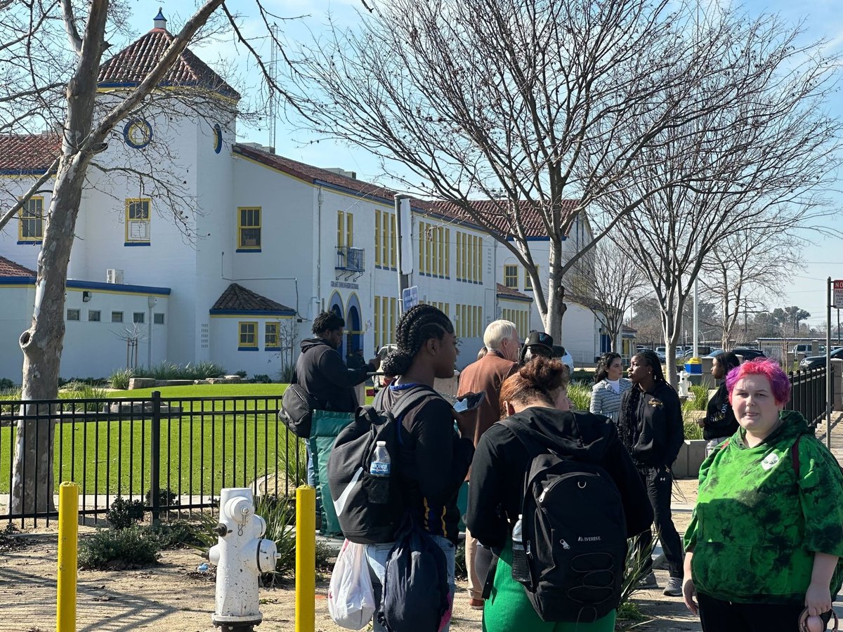 Students stand outside Grant High School during a lockdown on Jan. 30, 2024.