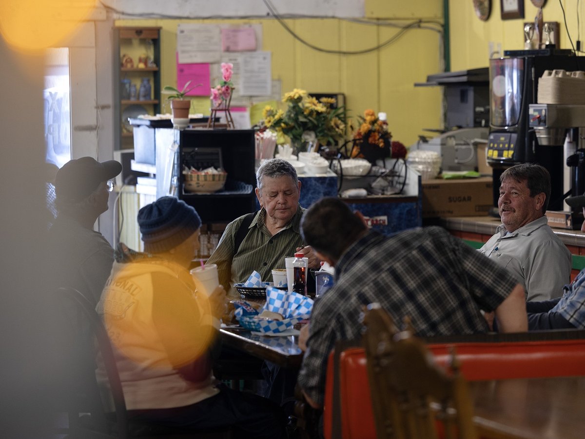 A small group gathers for lunch at Big Valley Market on Jan. 30. 2024. The market serves as the main grocer, restaurant and community gathering space for the town of Bieber.