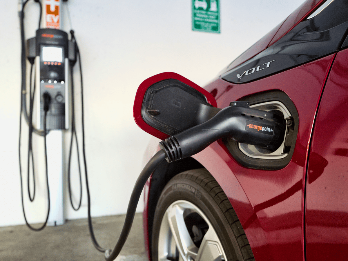 A Chevrolet Volt hybrid car is seen charging at a ChargePoint charging station at a parking garage in Los Angeles, Oct. 17, 2018.