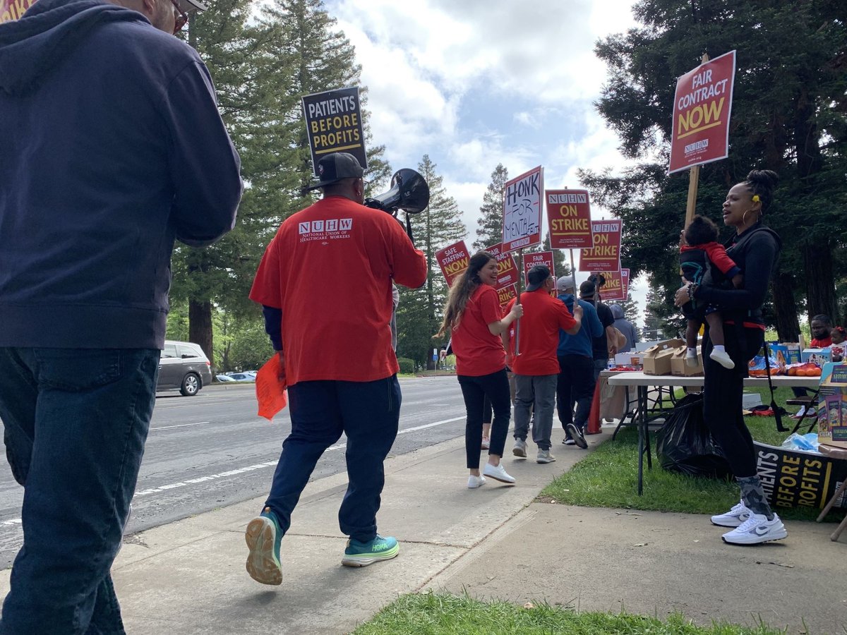 Workers picket outside the Sutter Center for Psychiatry on Folsom Boulevard near Power Inn Road on April 25, 2024.