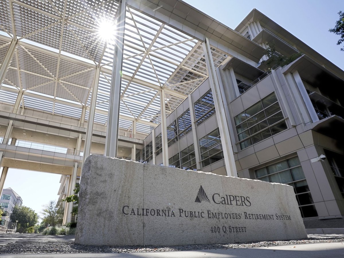 The suns peaks over the California Public Employees Retirement System's building in Sacramento, Calif., Tuesday, Sept. 6, 2022.