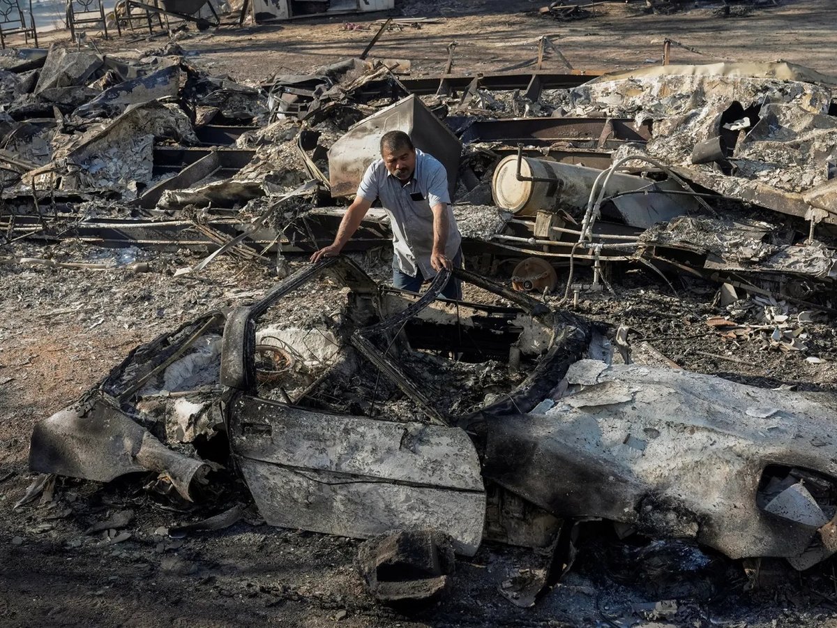 Luis Quinonez surveys the damage to his property in the aftermath of the Highland Fire in Aguanga on Oct. 31, 2023.