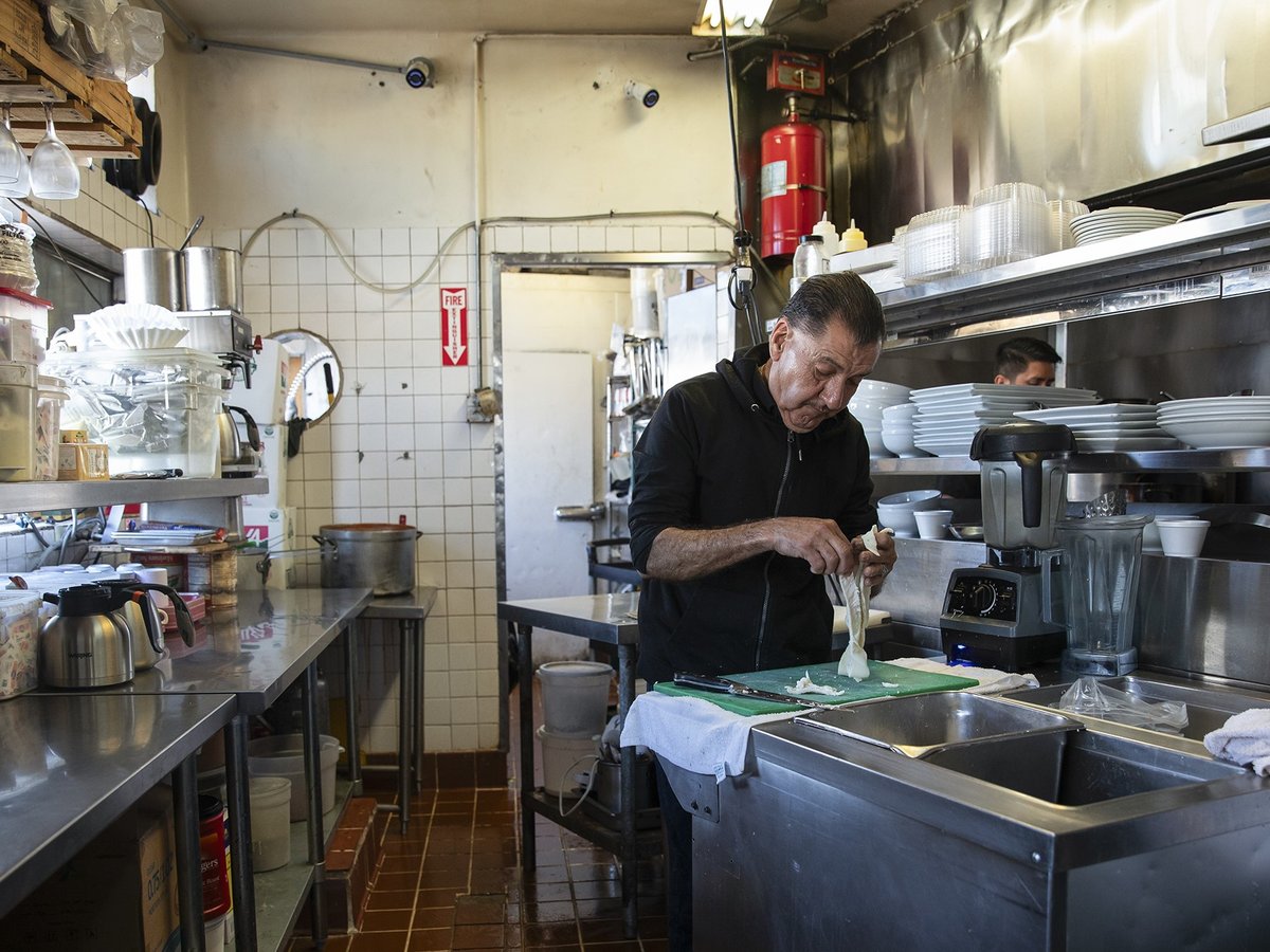 Sergio Carrillo prepares food at El Rincon restaurant in the San Ysidro neighborhood of San Diego on April 16, 2024.