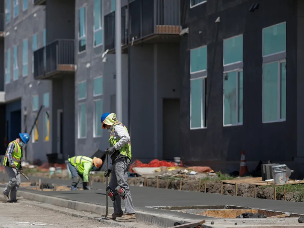 A construction crew works on a 290-unit transit-oriented, mixed-use affordable housing community in Fremont on April 22, 2020.